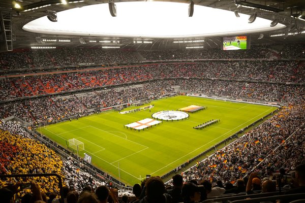 How can UK sports academies attract international talent?